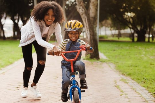Happy,Cute,Boy,Learn,To,Ride,A,Bike,With,His